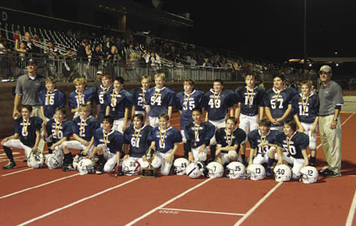 The sixth-grade football team at St. Thomas Aquinas Catholic School