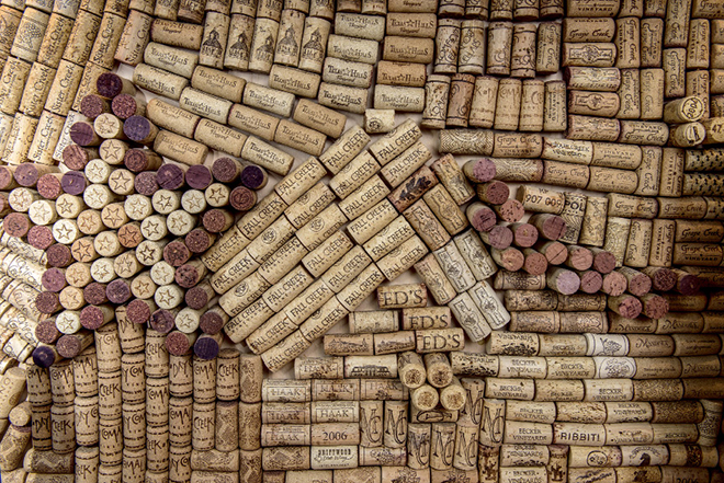 One day Suzy had the idea to use a collection of old wine corks to create a mural as the backsplash of the wet bar, and she asked a friend to design it for her. “We really did drink all the wine,” she says, laughing. Photo by Danny Fulgencio 