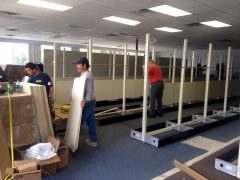 Ace staff prepares the old Premium Title Lending location for the temporary move