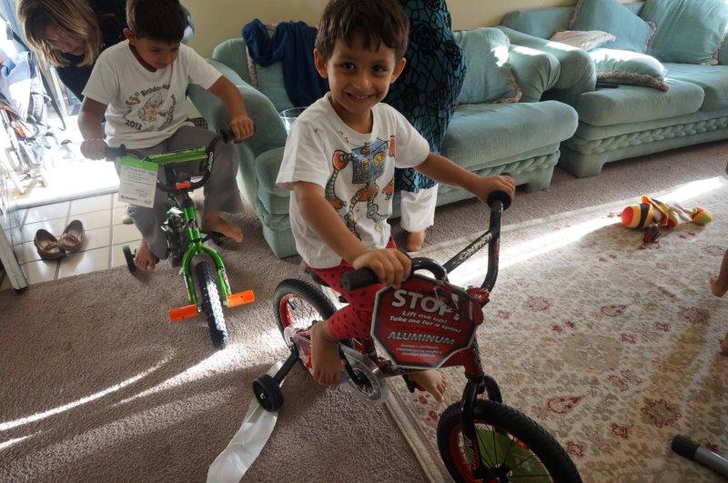 Young refugees at the Vineyard Apartment in East Dallas revel in their newly gifted toys. (Photo from DFW International Community Alliance)