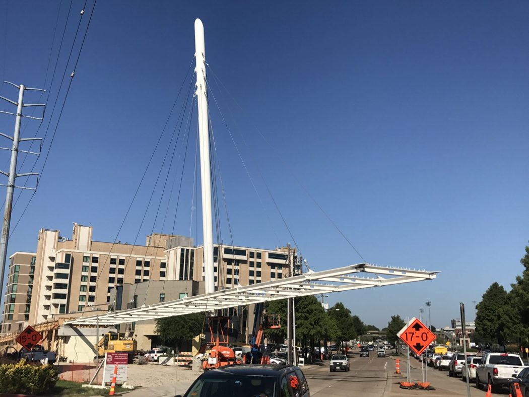 The final pieces of the pedestrian bridge at Mockingbird Station are following into place. (Photo by Advocate reader Jeff Snoyer)