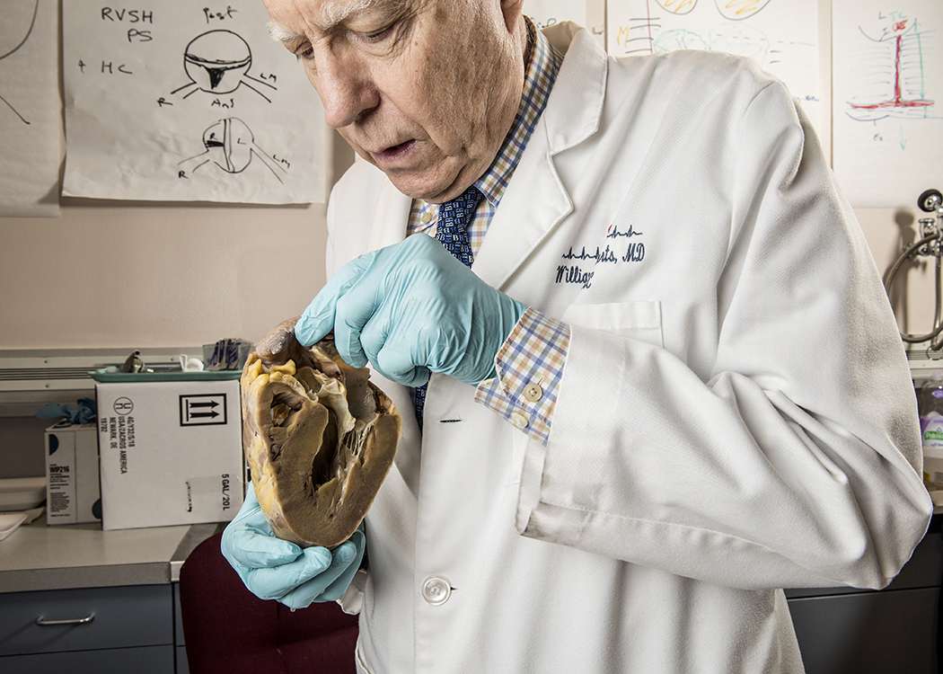 Dr. William Roberts meets with transplant patients and teaches them about their former heart. (Photo by Danny Fulgencio)