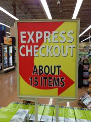 This Kroger sign leading to the express checking lane seems kind of vague.