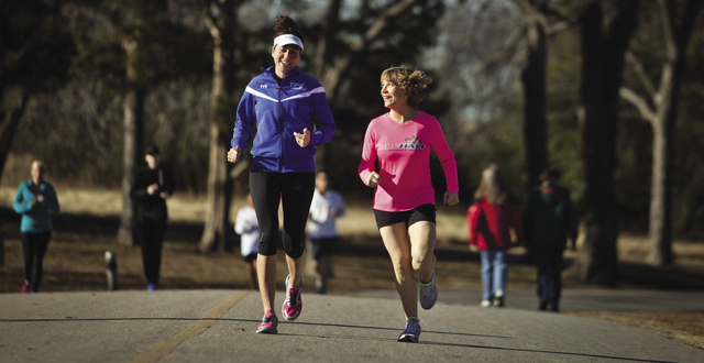 Joyce Kelley (right), who has the neurological disorder CMT, still trains with her running group: Kim Leeson