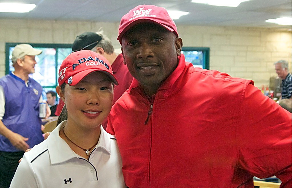 Grace Choi, Texas Girls Golf Champion 2013, poses with fellow Woodrow Wilson Wildcat Tim Brown at his annual golf tournament benefiting the school. Brown is Woodrow’s second Heisman Trophy winner. Photo by Tom Crabb, golf coach at Woodrow and alumnus of the school. 