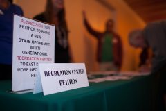 Local citizens and business owners sign a petition for the proposed recreation wellness center. Photos by Rasy Ran