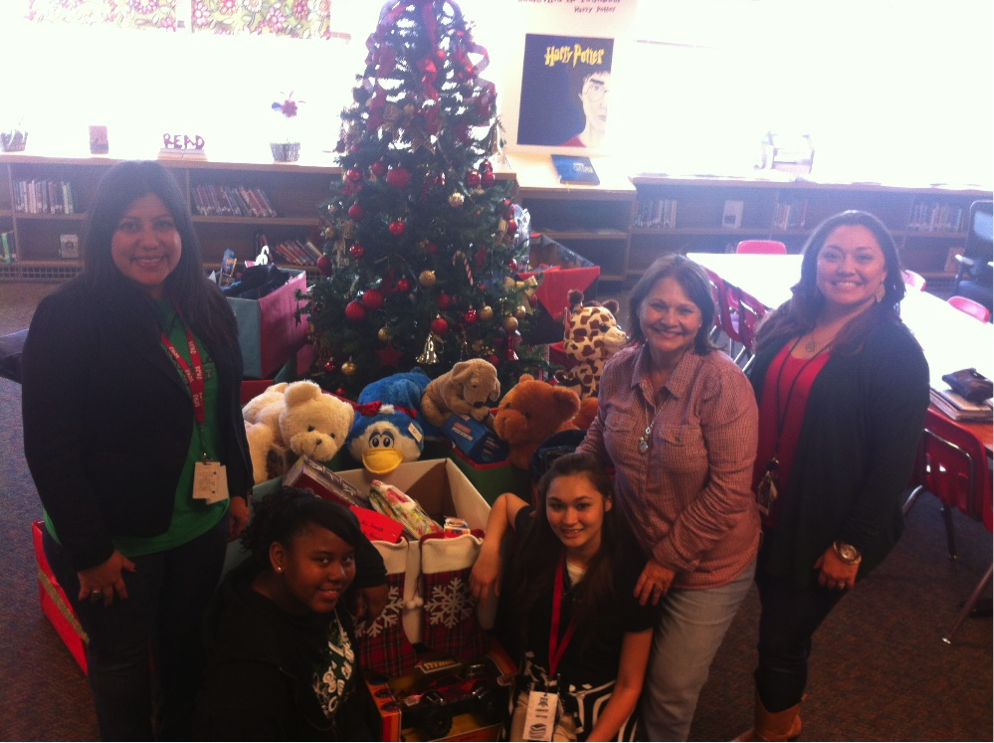 Principal Ruiz, Zaria Sample, Brenda Moya, librarian Maria Rodriguez,  and assistant principal Kastl