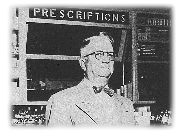 Doc Harrell at his pharmacy counter in 1953.