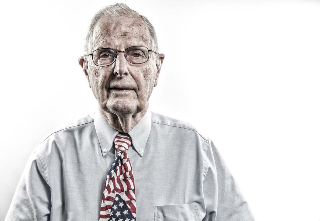 Gilbert Clift poses for a portrait at CC Young Retirement Community in Dallas, TX on Sept. 30, 2015. Clift served in the US Army in Europe during WWII. He fought in the Battle of the Bulge, where he was captured by Nazi forces and held as a prisoner of war until April 15, 1945. Clift said that, after having been living in a frozen hole for a month during the Bulge, being a prisoner of war in a warm makeshift prison was unexpectedly pleasant. Photo by Danny Fulgencio