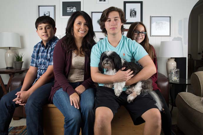 Lake Highlands, TX 11/1/15 From left: Matthew, Teresa, Samuel and Sara Hendricks along with the family dog Snoozy pose for a photo in their Plano home November 1, 2015. The family are on the road to recovery after the father, Rusty, passed away from a car repair accident March 7, 2011. (Photo Credit: Rasy Ran)