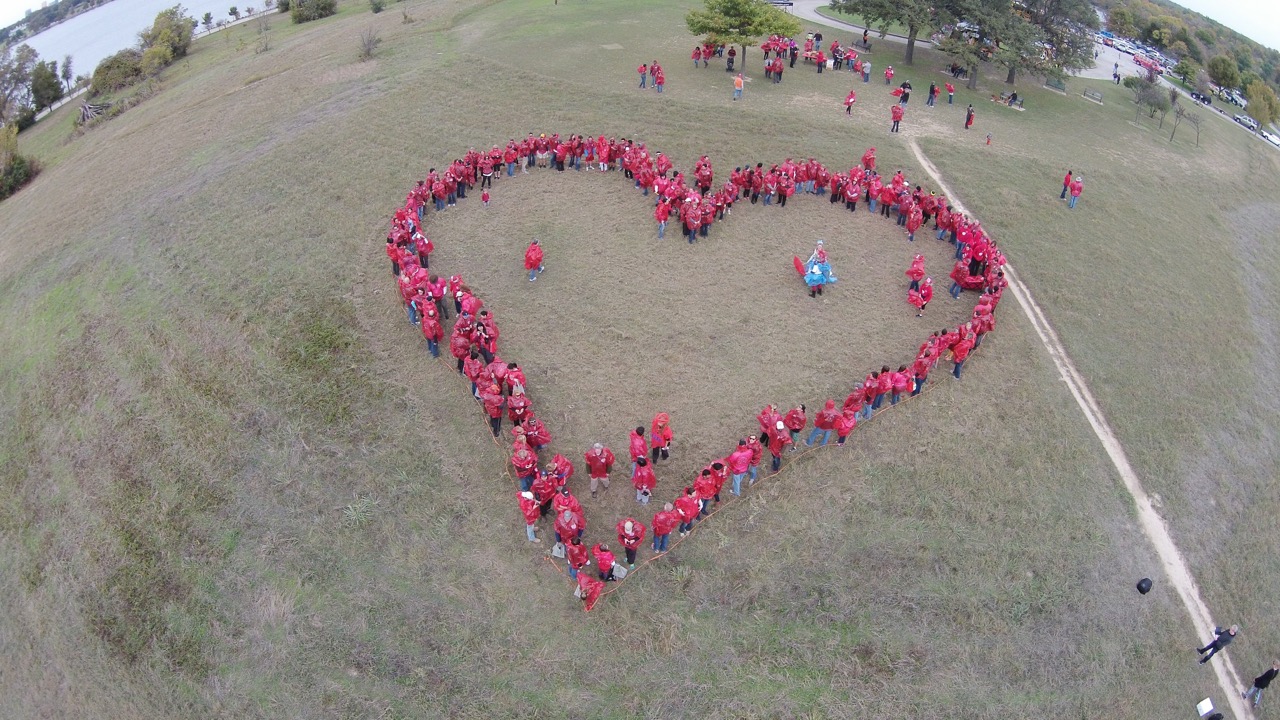 Photos from above: For the Love of the Lake forms a heart shape out of  people in an attempt to set a world record - Lakewood/East Dallas