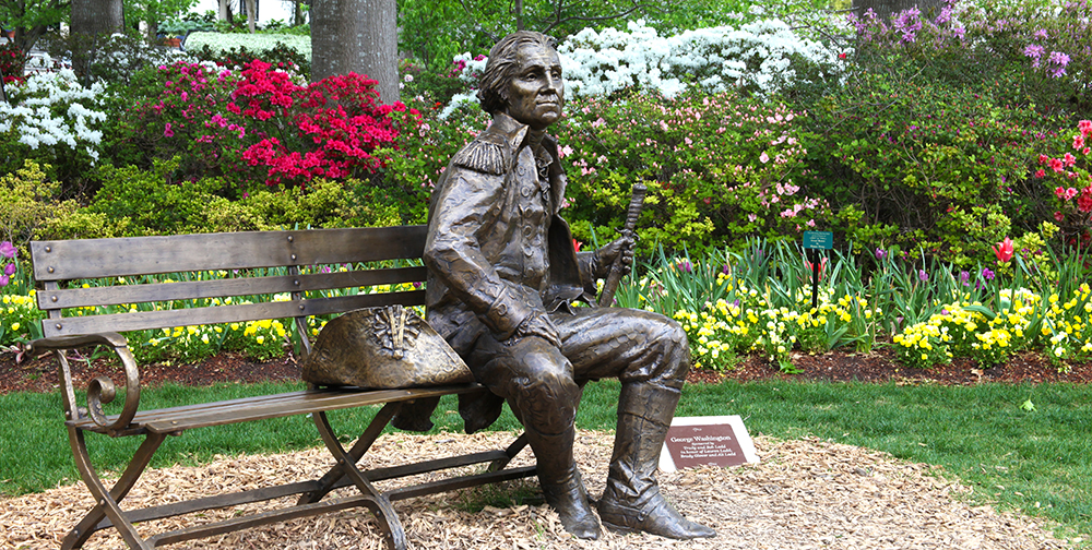 The Dallas Arboretum offers "The Great Contributors," a display of bronze sculptors of legendary figures by Gary Lee Price. 