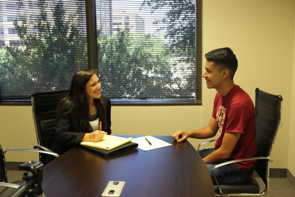Woodrow Wilson High School senior Esmerelda Miguel interviews another intern as part of her duties at Independent Insurance Agents of Dallas in the Mayor’s Intern Fellowship Program. 
