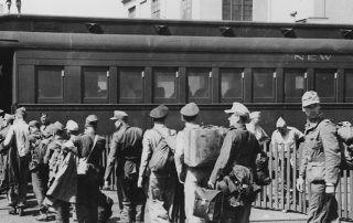 German prisoners of war enter a train car at Mexia in Texas. Some 200,000 German P.O.W.s were housed in Texas from 1943-45. Below, German P.O.W.s were paid 80 cents per day in canteen coupons. (Images courtesy of the Friends of Camp Hearne)
