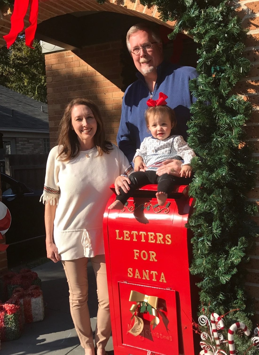The Lyons family with Santa's mailbox. Image courtesy of the Vickery Place Neighborhood Association. 