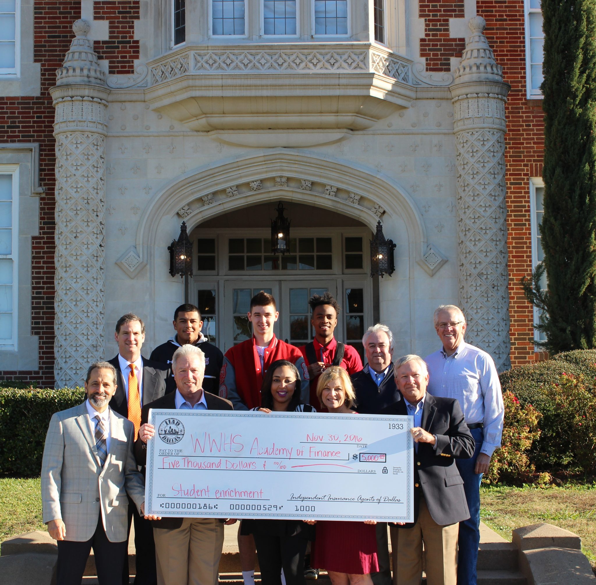 Pictured, from left, in front: John Losurdo (IIAD), Bruce Sams (IIAD), Dionne Hilliard (Academy of Finance director), Tammy Land (IIAD), Tim Webster (Exchange Club). From left in back: Vince Bell (IIAD), Armando Navarro (Woodrow student), Jake Patin (Woodrow student), Kullen Smith (Woodrow student), Fred Baker (Exchange Club), Gray Powers (Exchange Club).