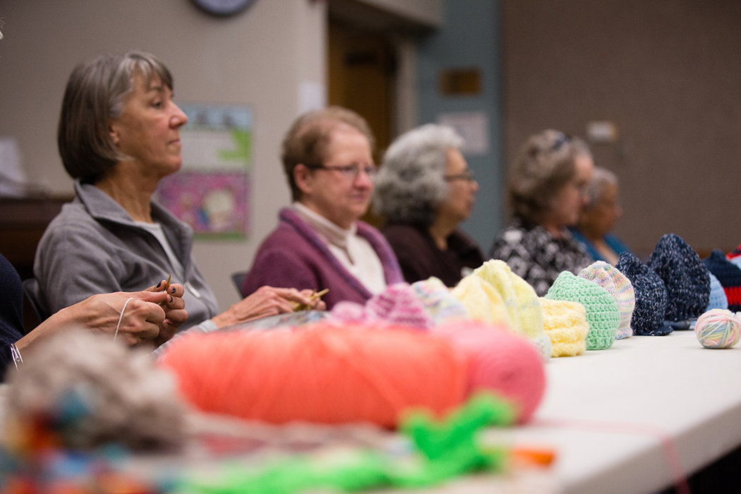 The yarn flies every Tuesday when the KnitWits take over the Lakewood Library. (Photo by Rasy Ran)
