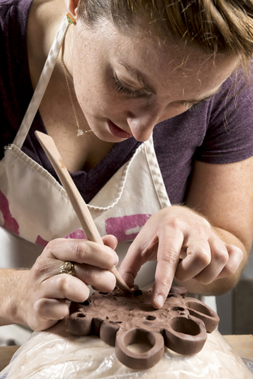 Andrea Brashier demonstrates the unique process with which she makes her ceramics. (Photo by Danny Fulgencio)