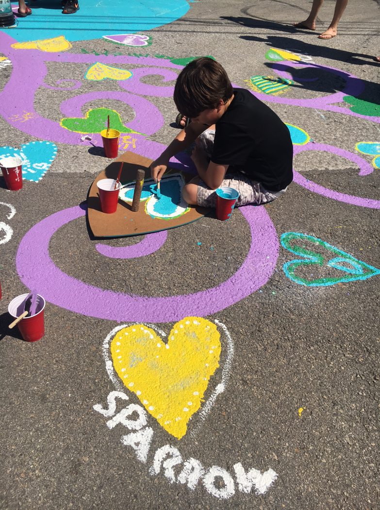 The whole neighborhood came together in Little Forest Hills to paint a street mural on Eustis on Sunday, June 11, 2017. (Photo by Emily Charrier/Advocate Media)