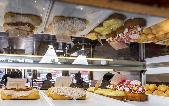 Hypnotic Donuts’ elaborate toppings add to Garland Road’s unique flavors. Below: Goodfriend Package is hip down to its comical signage.