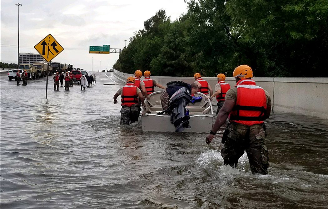 Woodrow teacher Michah Hill assists flood victims in Houston following Hurricane Harvey. (Photos by Lt. Zachary West , 100th MPAD)