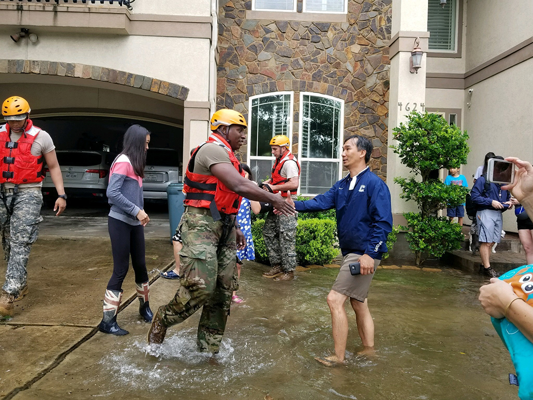 Woodrow teacher Micha Hill assists flood victims in Houston following Hurricane Harvey. (Photos by Lt. Zachary West , 100th MPAD)