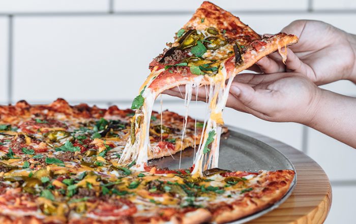 The Mexican Pizza is a spicy and savory combination of poblano peppers, jalapenos, cilantro, hamburger and cheddar at Greenville Avenue Pizza Company (Photo by KathyTran)