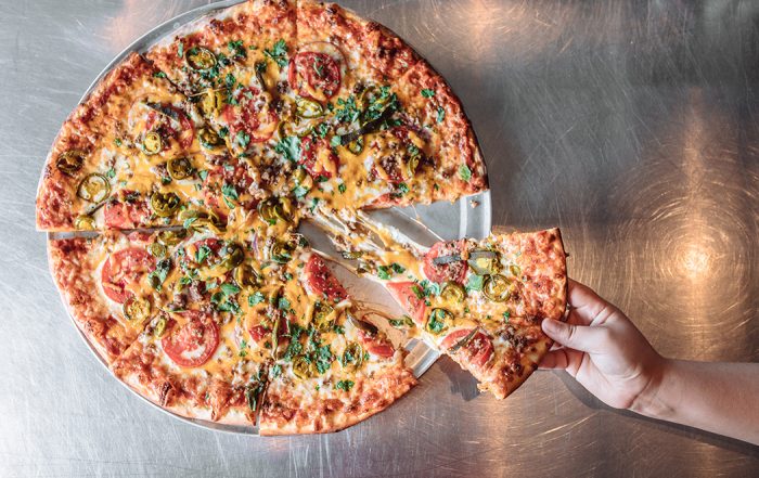 The Mexican Pizza is a spicy and savory combination of poblano peppers, jalapenos, cilantro, hamburger and cheddar at Greenville Avenue Pizza Company (Photo by KathyTran)