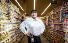 Tom Thumb manager Carrie Johnson poses in the canned food aisle.