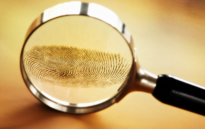 Magnifying glass and fingerprint