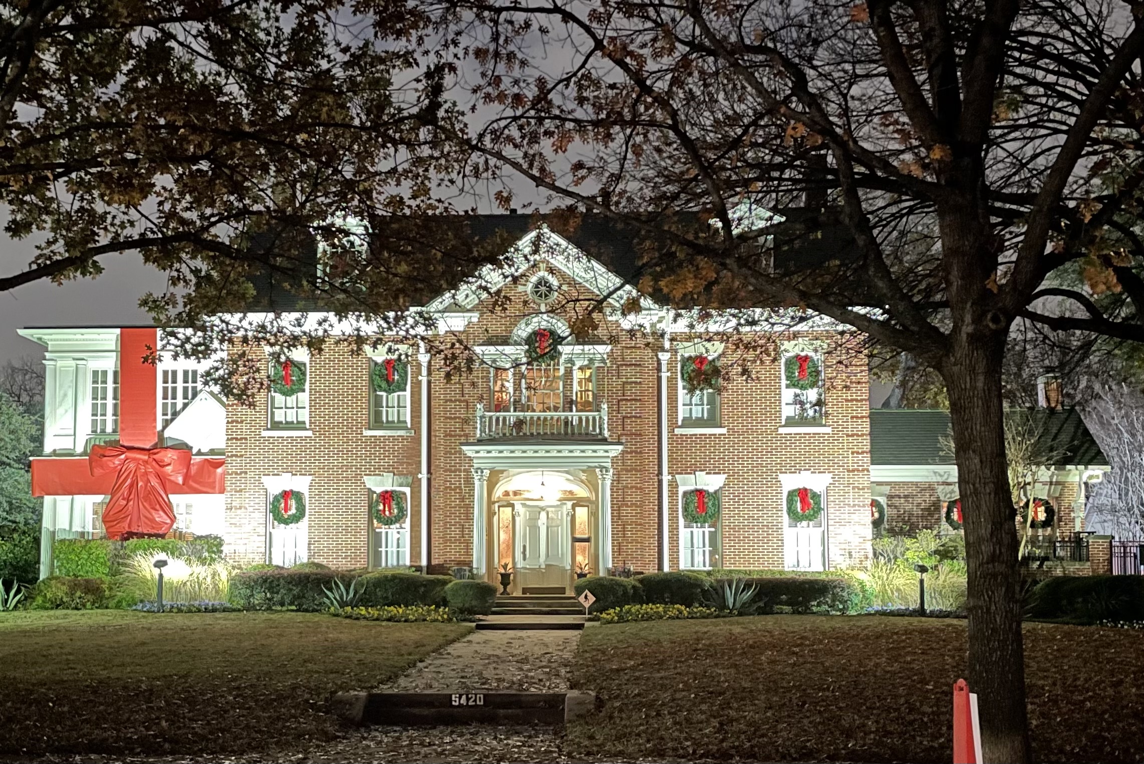 Swiss Avenue home decorated with wreaths and bow