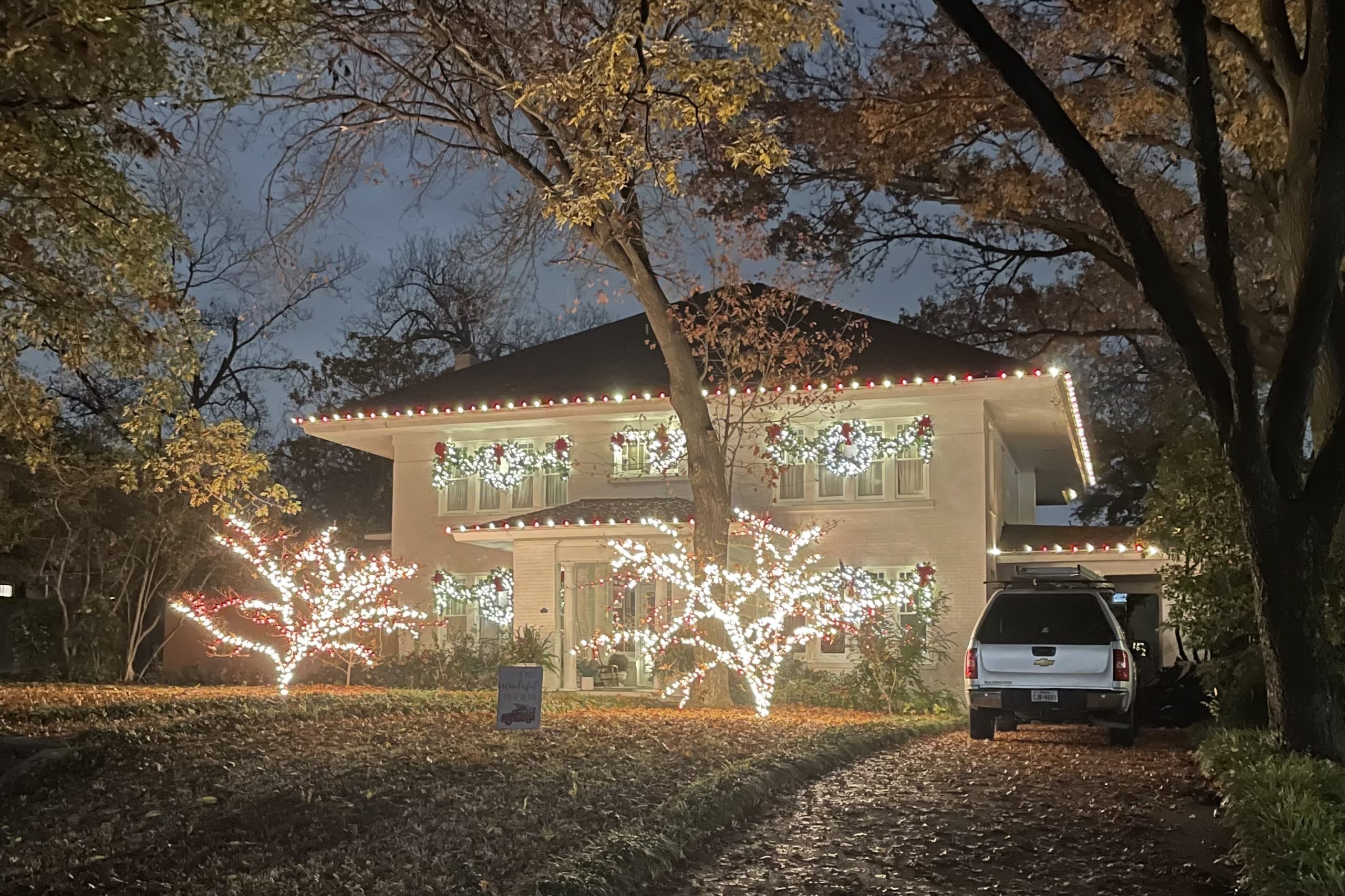 Lights on home and trees in Swiss Avenue