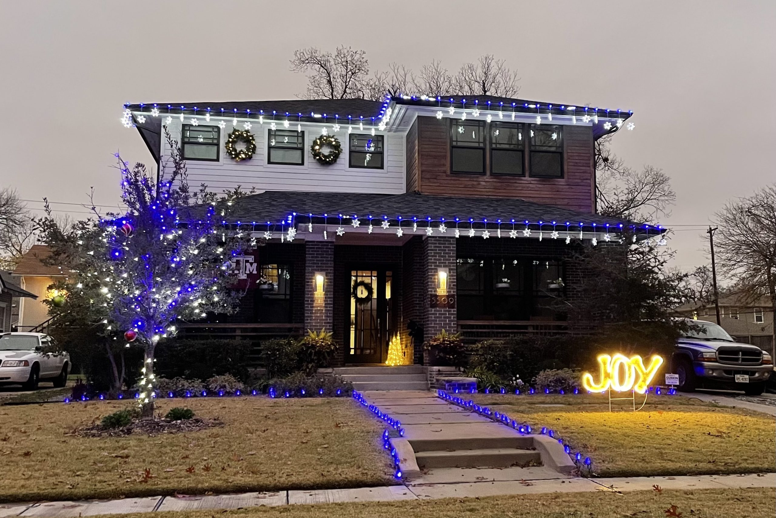 Vickery Place home with blue and white lights