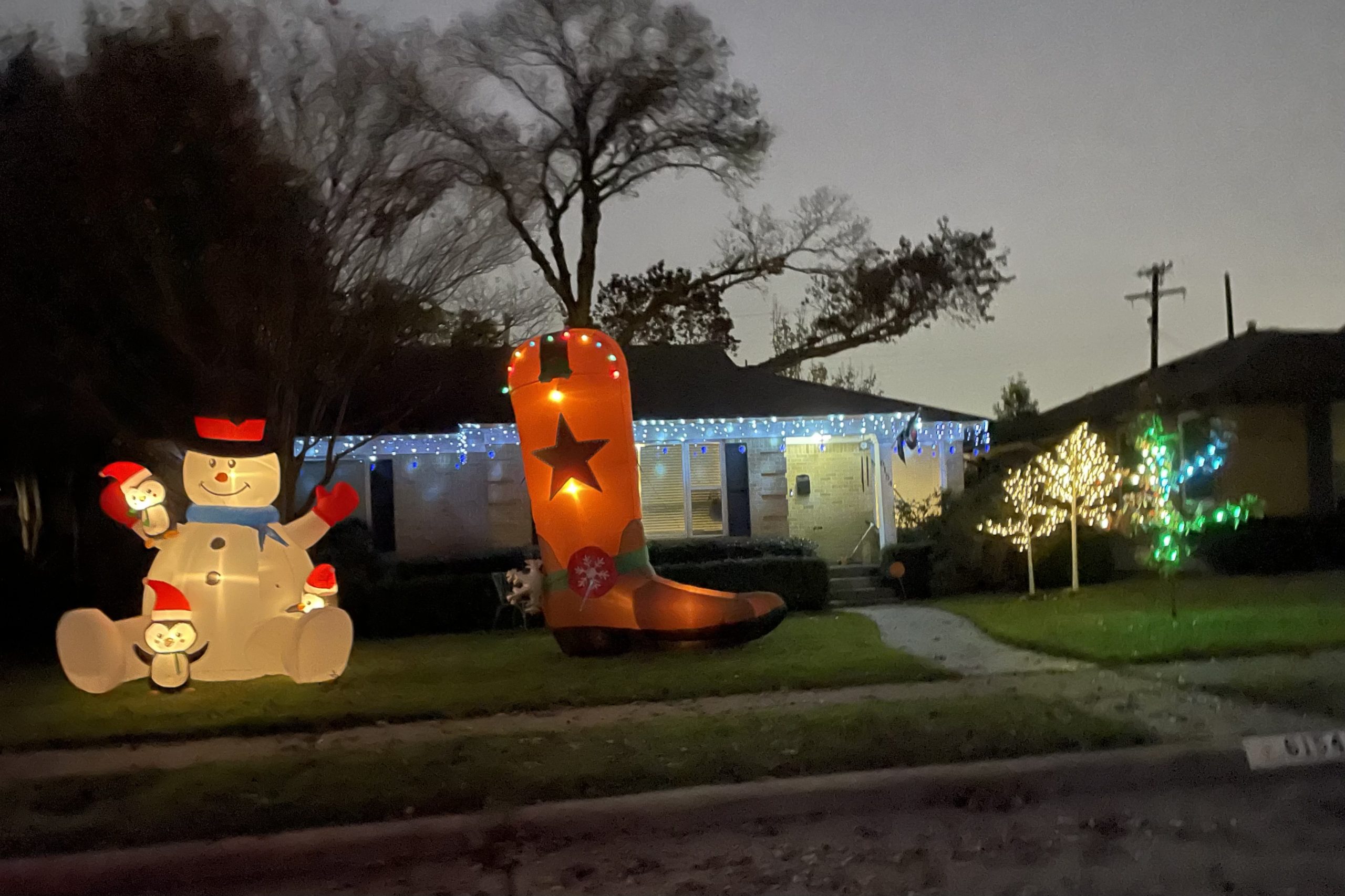 Inflatable snowman and cowboy boot in Caruth Terrace