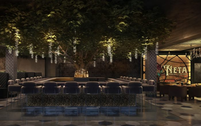 La Neta Cocina y Lounge interior with chairs and greenery overhead