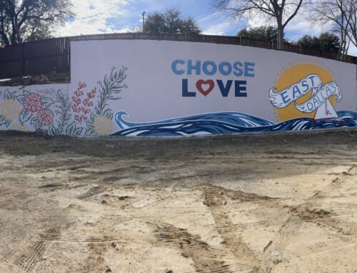 Local muralist gives some TLC to the once blank wall near the 3G