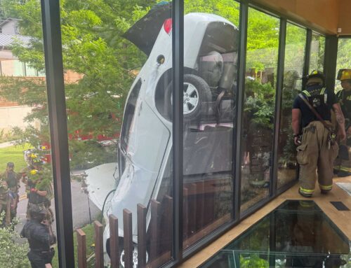 Steel pickets save driver (and house) in cartwheel crash near White Rock Lake