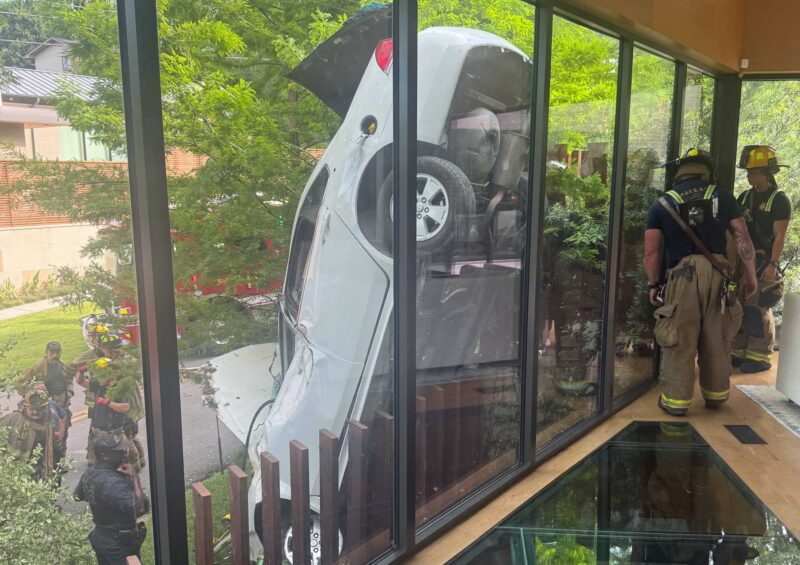 Steel pickets save driver (and house) in cartwheel crash near White Rock Lake